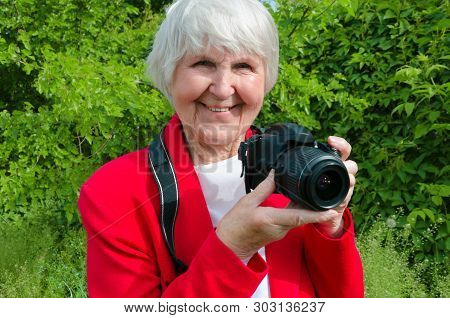 Portrait Of Smile, Happy Grandmother Enjoy Her Hobby At Sun Day. Modern Caucasian Granny Is Professi