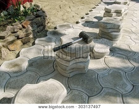 On The Workplace Paving Slabs, Materials And Work Tools, Close-up. The Concept Of Laying Concrete Pa
