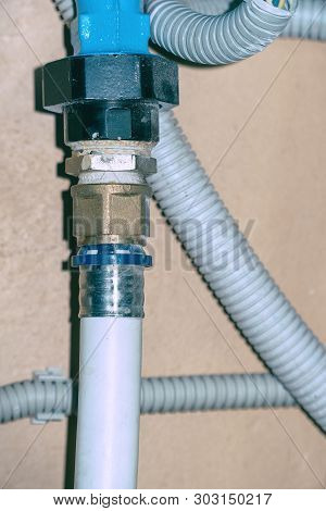 Connection Of Plastic Pipes Through The Coupling. Plumbing Water Supply