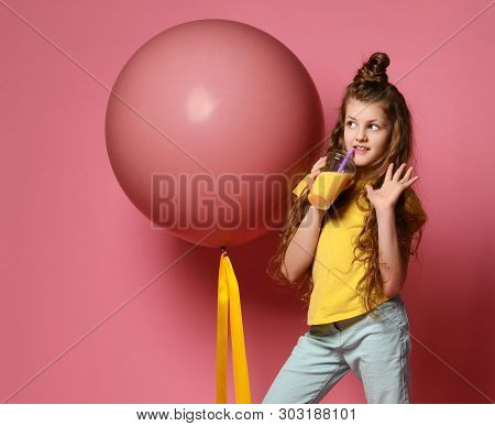 Cool And Fashion Teen Girl In Jeans And Yellow T-shirt Stepped On Big Pink Balloon Yellow Tape, Drin