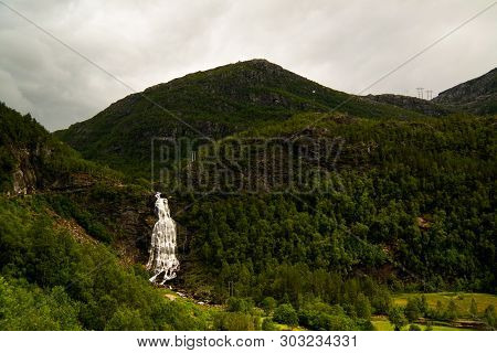 Panoramic View To Fossenbratte Waterfall At Lona River In Samnanger , Norway