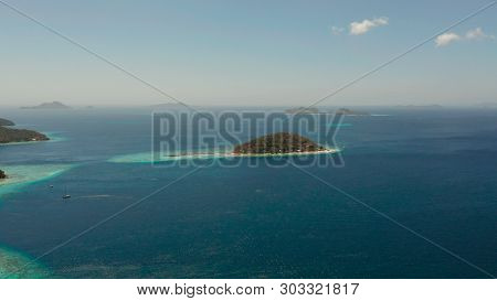 Aerial View Tropical Beach With White Sand And Clear Blue Sea. Tropical Landscape With Islands And B