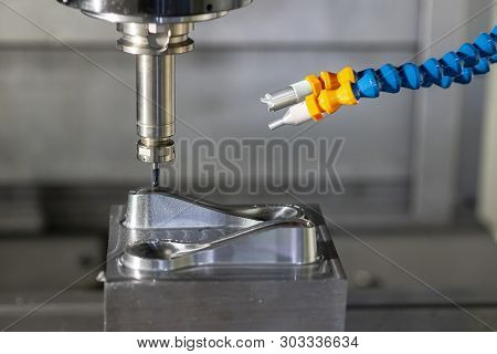 The  Cnc Milling Machine Cutting The Mould Part With The Solid Ball End Mill Tool.the Hi-technology 