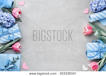 Springtime Flat Lay With Giift Boxes, Seasonal Flowers And Eucalyprus Leaves, Space For Your Text