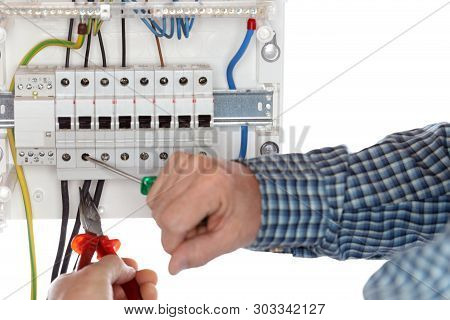 Electrician Is Repairing An Electrical Circuit With Tools
