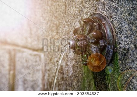 Wellspring With Crystalline, Pure And Bright Water. Low Angle