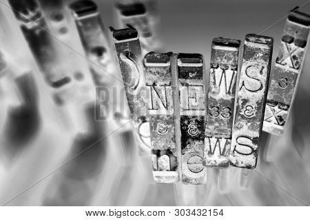 the word NEWS with old typwriter hammers macro image  monochrome image 