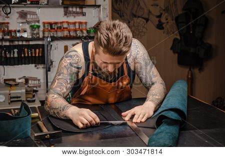 Skinner Producing A Leatherwork At The Workshop