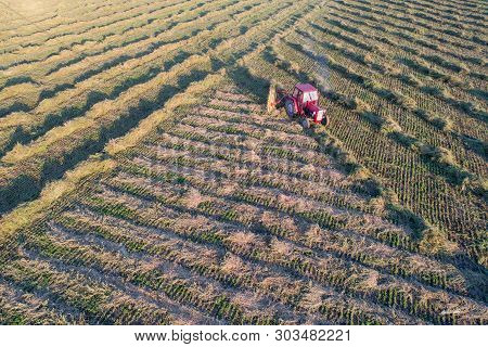 Aerial Image Of Tractor With Hay Tedders