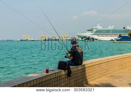 George Town Penang Island Malaysia. March 2019. A View Of Fisherman Along The Walkway Boulevards In 