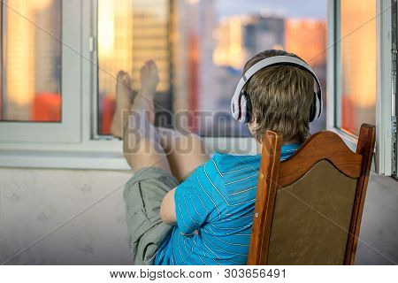 Guy In Headphones Are Audiophile Enjoying Life Listening To Music Sitting Upside Down In Big Headpho