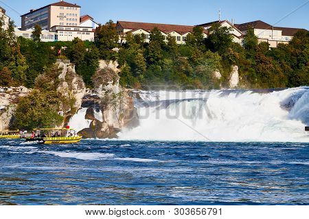 Rhine, Switzerland - September 19, 2018: Tourist Ship On The Rhine River Approaching The Rhine Falls