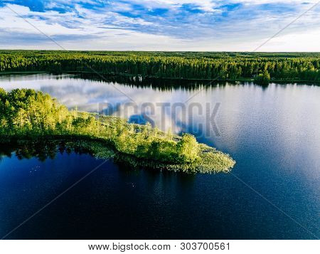 Aerial View Of Blue Lakes Landscape With Green Forests On A Sunny Summer Day In Finland.