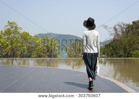 traveling woman walk at Xiangshan Visitor Center, Sun Moon Lake, Nantou, Taiwan