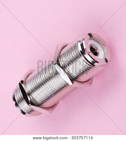 Radio Connector On Pink Background At Dry Sunny Summer Day