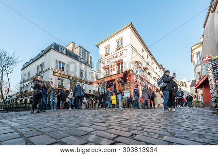 Paris, France - April 12, 2019 : People Sitting At The Terrace Of Le Consulat Restaurant In Montmart