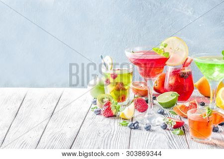 Selection Summer Fruit And Berry Cocktail Drinks. Wooden Background Copy Space