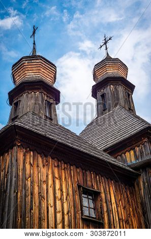 Orthodox Wooden Church In The Ukrainian Village Under Dramatic Skies