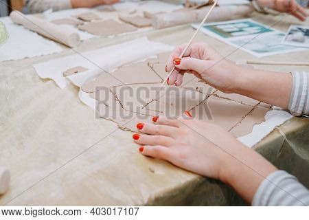 Womens Hands Knead Clay, Drawing Elements Of The Product. Production Of Ceramic Products At The Mast