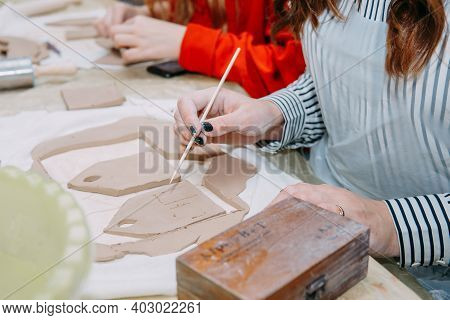 Womens Hands Knead Clay, Drawing Elements Of The Product. Production Of Ceramic Products At The Mast