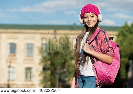 Keeping Your Ears Safe And Music Loud. Happy Child Wear Headphones Urban Outdoors. Modern Technology