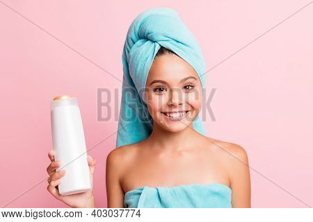 Portrait Of Pretty Sweet Girl Wear Teal Towel Show Shower Gel Isolated On Pastel Pink Background