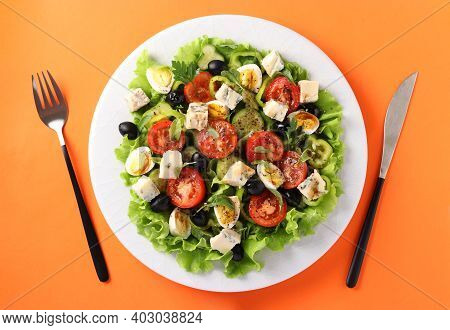 Healthy Salad Of Cherry Tomatoes, Cucumbers, Peppers, Black Olives, With Olive Oil, Quail Eggs And G