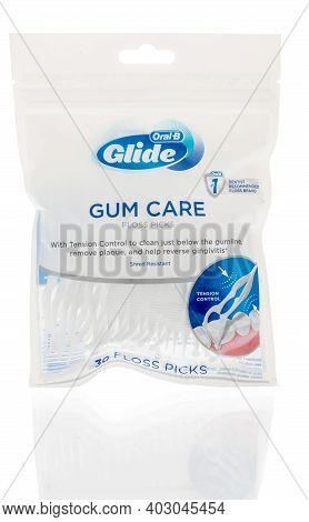 Winneconne, Wi -4 January 2021: A Package Of Oral B Glide Gum Care Floss Picks On An Isolated Backgr