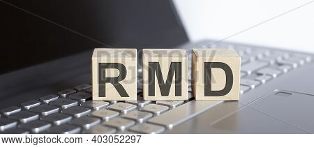 Rmd Abbreviation Stands For Written On Wooden Cube On Laptop