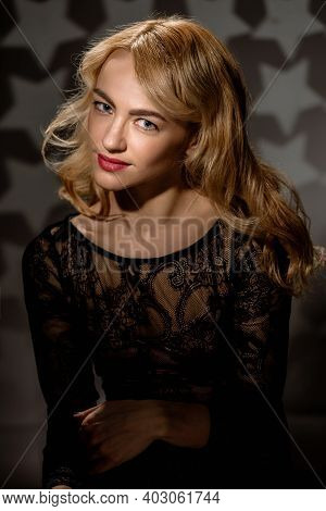 Vintage Portrait Of Attarctive Glamorous Young Woman Posing On Studio Background