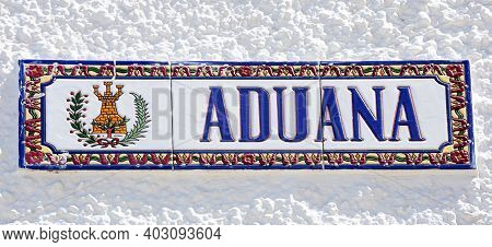 Ayamonte, Spain - June 11, 2017 - Ceramic Customs (aduana) Sign On A Building Along The Waterfront, 