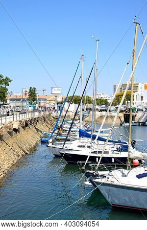 Olhau, Portugal - June 12, 2017 - View Of Yachts Moored In The Marina Against The Avenida 5 De Outub