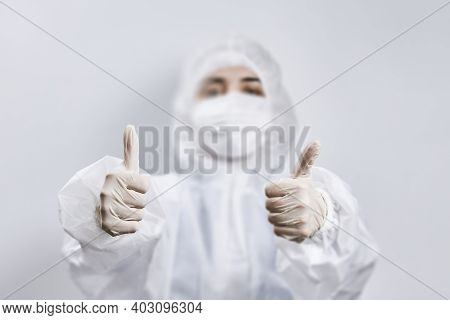 Portrait Of A Doctor Fighting Against Coronavirus. A Nurse In Medical Protective Wear Looking At Cam