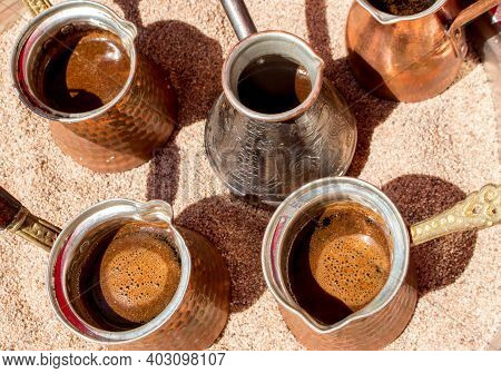 The Turkish Coffee In Cezve In The Hot Sand