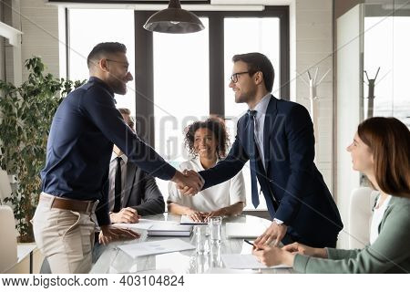 Happy International Businessmen Handshake At Office Business Meeting