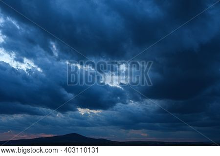Stormy Sky With Storm Clouns On The Sunset With Beautiful Sun