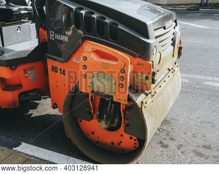 Russia, Sochi 05.07.2020. A Fragment Of An Orange Black Road Roller Parked On The Side Of The Road