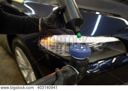 Detailing Master Applies Car Polish Paste To The Polisher. Vehicle Paintwork Polishing Concept
