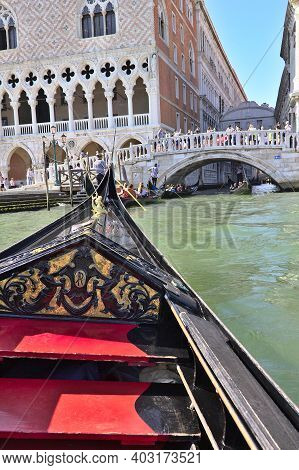 Venice, Italy - 3 August, 2016: Tourists Enjoying The Gondolas In The Canals Near The Bridge Of Sigh