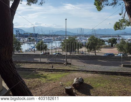 Arbatax , Sardinia, Italy, September 9, 2020: View Of Arbatax Harbour, Port With Sailing Ships And F
