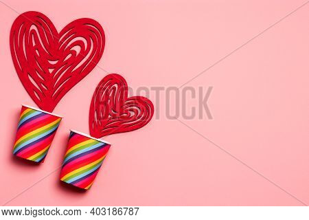 Valentines Day. Paper Cups Rainbow, Hearts On A Soft Pink Background. The Concept Of Gay Pride, Lgbt