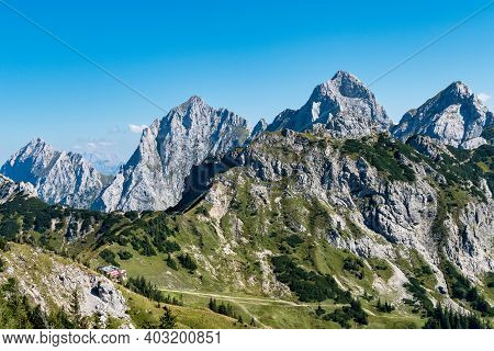 View To The Famous Mountain Red Flueh And Gimpel In The Valley From Tannheim In Austria.
