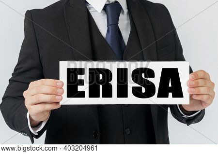 Business And Finance Concept. A Businessman Holds A Sign In His Hands Which Says - Erisa