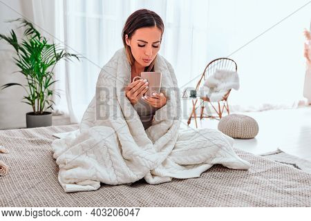Tea With Lemon. Sick Young Woman Drinking Hot Tea With Lemon After Catching Cold