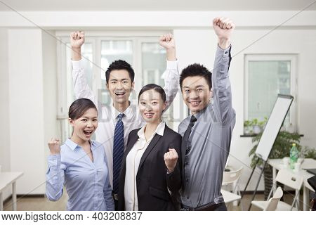 Group Of Happu Young Business People Cheering High Quality Photo
