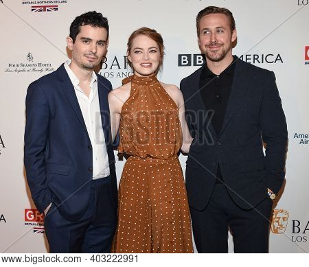 LOS ANGELES - JAN 7:  Damien Chazelle, Ryan Gosling and Emma Stone arrives for  BAFTA Los Angeles Tea Party 2017 on January 07, 2017 in Beverly Hills, CA