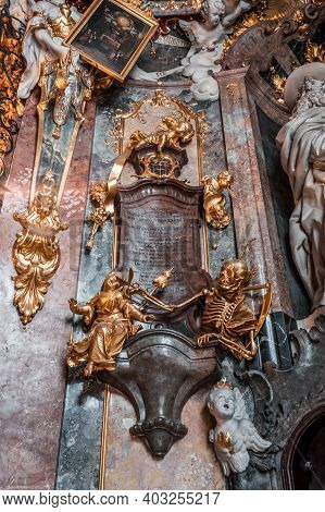 Feb 2, 2020 - Munich, Germany: Golden Skeleton Statue On Mural In Asamkirche
