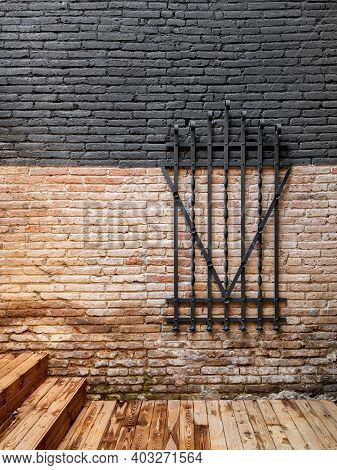 Forged Steel Metal Decorative Grille On A Brick Wall