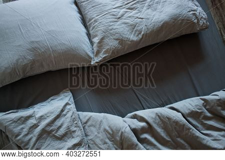 Blue Bed Sheets And Pillows After Night's Sleep.