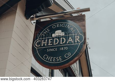 Cheddar, Uk - July 26, 2020: Sign Outside The Original Cheddar Cheese Co Shop In Cheddar, A Village 
